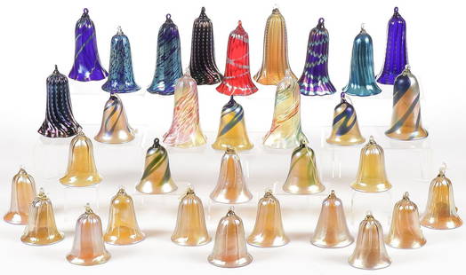 32 LUNDBERG STUDIO ART GLASS ORNAMENTS: 32 LUNDBERG STUDIO ART GLASS ORNAMENTS. Comprising 32 individual Lundberg trumpet bell-form ornaments of various sizes, in iridescent, swirled and ribbed designed as shown. A good many signed and one