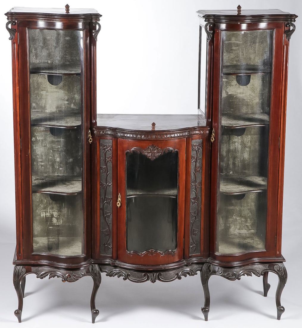ORNATE MAHAGANY ETAGERE, C 1890: ORNATE MAHAGANY ETAGERE, C 1890. On cabriole legs, with three glazed doors and the interior with shelves and lighting. Height 61 inches, width 56 inches, depth 17.5 inches.NO RESERVE. LOCAL PICK-UP OR