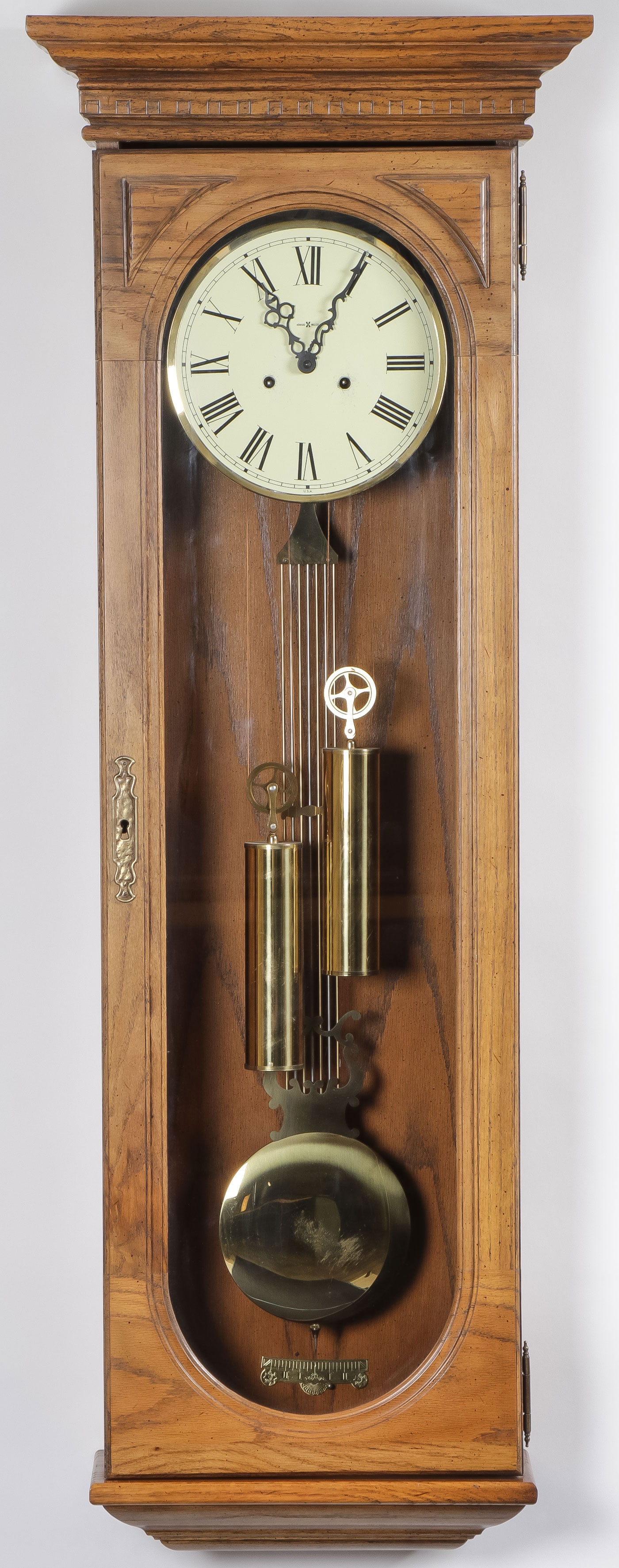 A HOWARD MILLER WALL CLOCK: A HOWARD MILLER WALL CLOCK. With two weights and pendulum. Height 51.5 inches. NO RESERVE. LOCAL PICK-UP OR 3RD PARTY SHIPPER ONLY.SHIPPING NOTICE:Except for large, oversized items, Jackson's is you