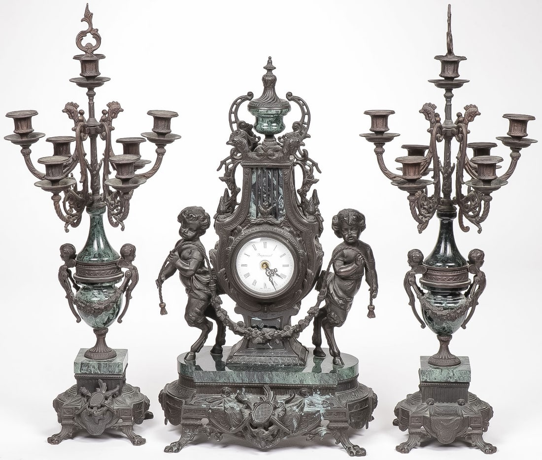 A FRENCH STYLE GARNITURE SET: A FRENCH STYLE GARNITURE SET. In the 19th century style with figural clock and matching seven-light candelabra. Modern. Greatest height 27.25 inches. NO RESERVE.SHIPPING NOTICE:Except for large, ove