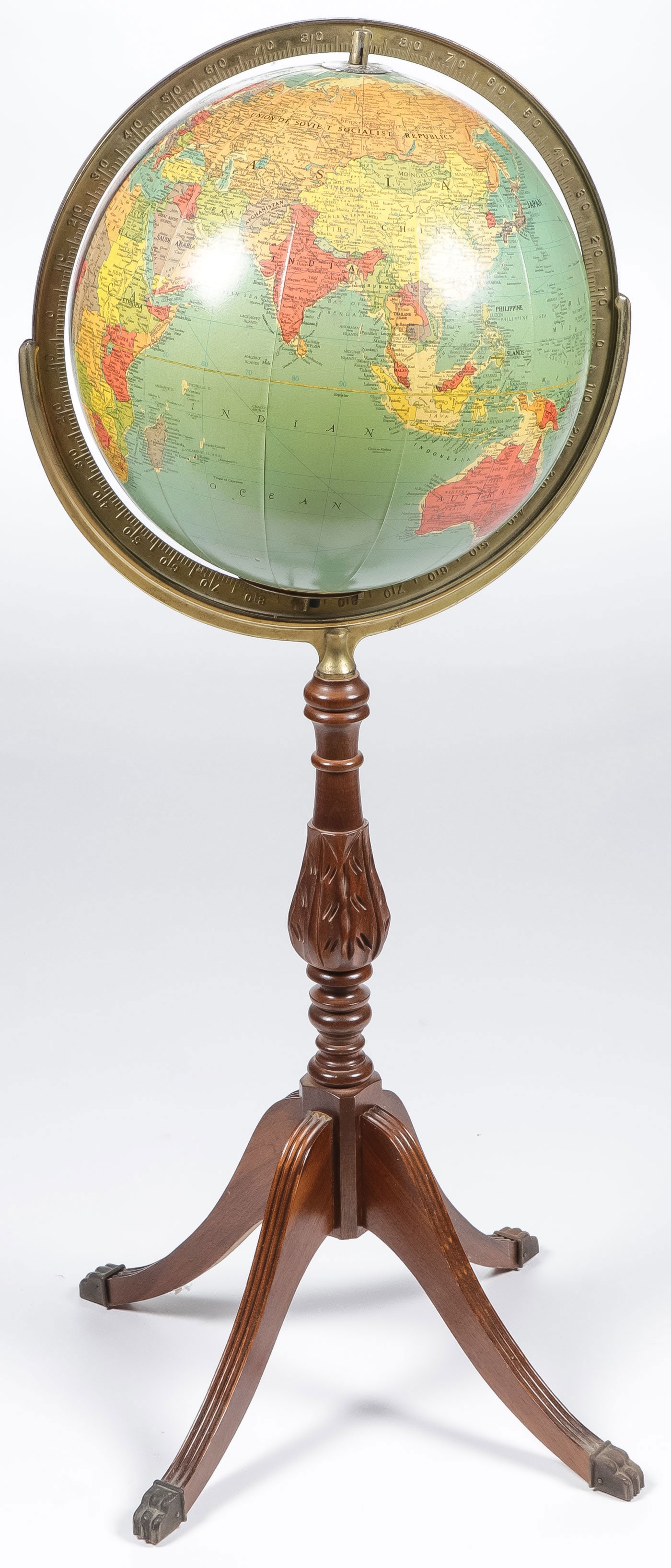 VINTAGE REPLOGLE ILLUMINATED LIBRARY GLOBE: VINTAGE REPLOGLE ILLUMINATED LIBRARY GLOBE. Comprising a 12 inch diameter illuminated library globe by Replogle on a wood four legged stand with brass paw endcaps. Overall height 36 inches. NO RESERVE