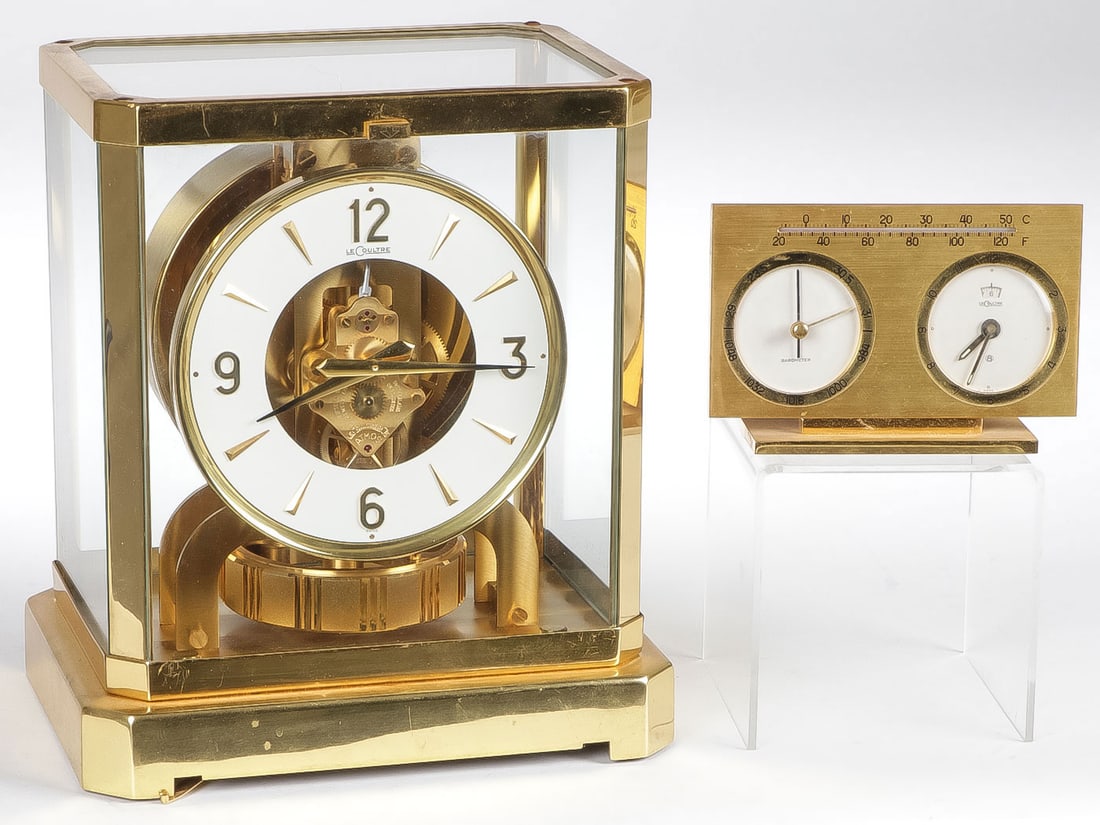LECOULTRE SWISS CLOCK & DESK BAROMETER: LECOULTRE SWISS CLOCK & DESK BAROMETER. Comprising a good Jaeger LeCoultre Atmos clock height 9.25 inches (24cm) and a Jaeger LeCoultre desk alarm clock, barometer and thermometer, height 3.5 inches (