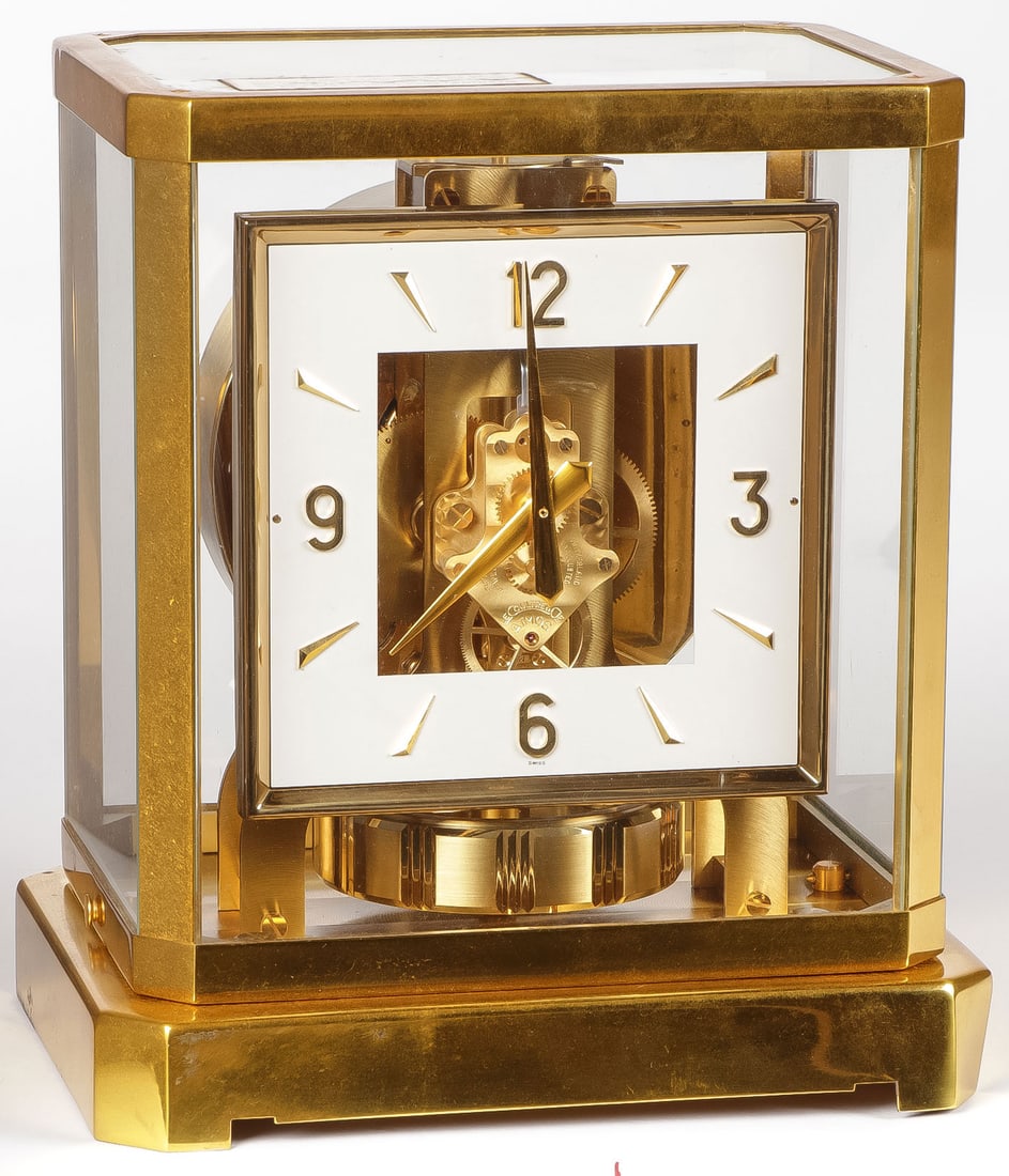 LECOULTRE SWISS ATMOS CLOCK IN BOX: LECOULTRE SWISS ATMOS CLOCK IN BOX. Comprising a LeCoultre Atmos "Perpetual Motion Clock", in the original box with papers. Height 9.25 inches (23.5cm). NO RESERVE. SHIPPING NOTICE: Except for large,