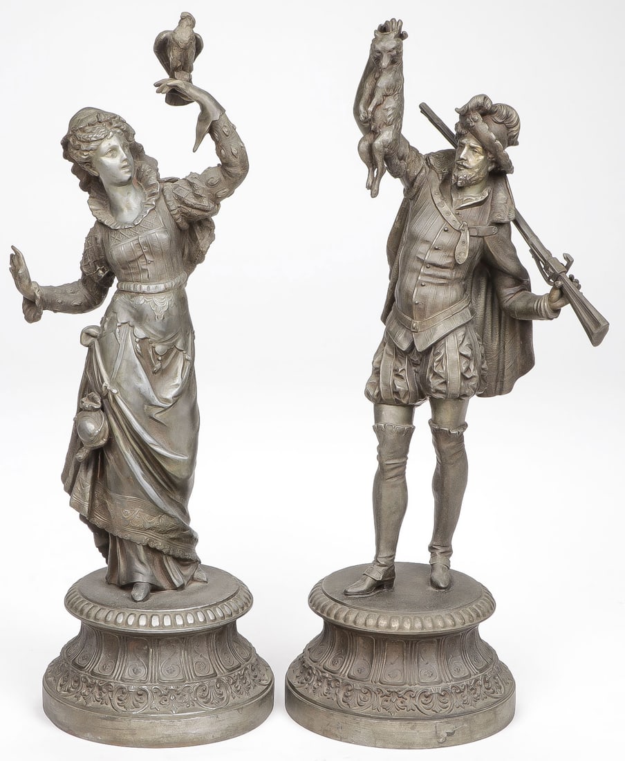 PAIR VICTORIAN HUNTER & FALCONER SCULPTURES: PAIR VICTORIAN HUNTER & FALCONER SCULPTURES. Comprising a pair of finely sculpted and detailed cast spelter ware figures, circa 1880, depicting a hunter and a huntress falconer, both on ornate integra
