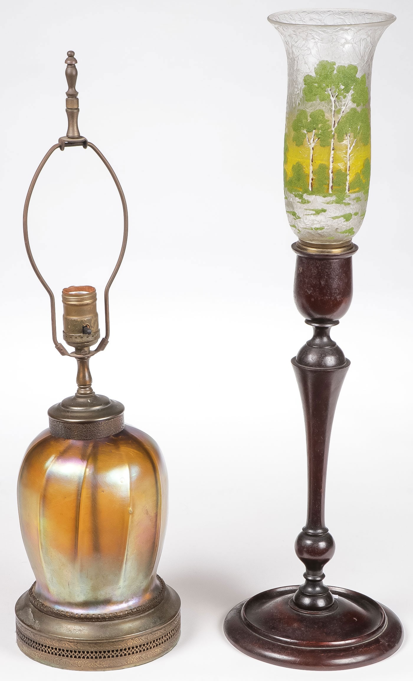 PR INTERESTING TABLE LAMPS: PR INTERESTING TABLE LAMPS. Comprising a likely Steuben gold iridescent ribbed vase form table lamp and a turned wood lamp base with etched cameo shade and ice chipped finish. All need rewired. Greate