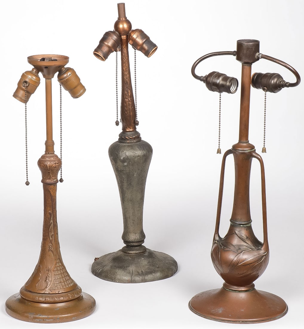 THREE VINTAGE TABLE LAMP BASES: THREE VINTAGE TABLE LAMP BASES. The first with cloth label of The Charles Parker Co., the second likely a Handel, and the third likely Pittsburg. All need rewiring. Greatest heigh 23 inches. NO RESERV