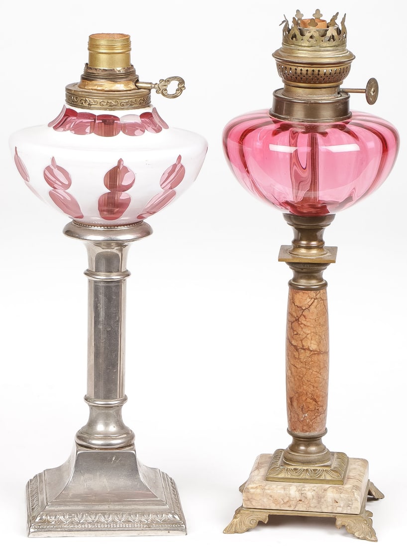PAIR OF VINTAGE OIL LAMPS: PAIR OF VINTAGE OIL LAMPS. Comprising a pair of vintage oil lamps with art glass oil reservoirs and later electrified. Greatest height 15 inches. NO RESERVE. SHIPPING NOTICE: Except for large, oversiz