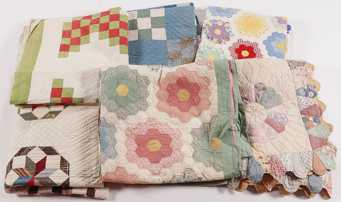 SIX ANTIQUE AMERICAN QUILTS: SIX ANTIQUE AMERICAN QUILTS. Comprising six vintage antique quilts of various patterns as shown, standard sizes. Provenance: From the estate of noted antique dealer Paul Brenner (1952-2024) Spencer,