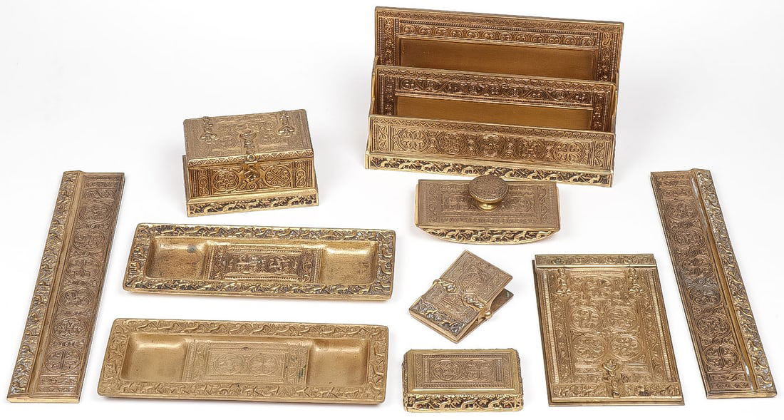10 PC TIFFANY STUDIOS VENETIAN DESK SET: 10 PC TIFFANY STUDIOS VENETIAN DESK SET. Comprising 10 individual pieces including a large double letter rack, hinged notepad cover and base, casket form double inkwell, a rectangular paperweight, a l