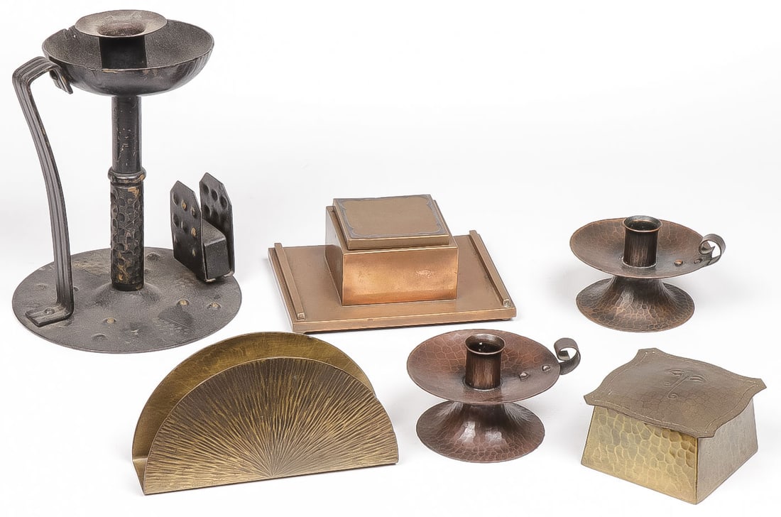 GOOD ARTS-N-CRAFTS METAL WARES GROUP: GOOD ARTS-N-CRAFTS METAL WARES GROUP. Comprising six individual pieces including a German marked hand hammered candlestick with integral handle and matchbox holder, height 7 inches, a Roycroft marked