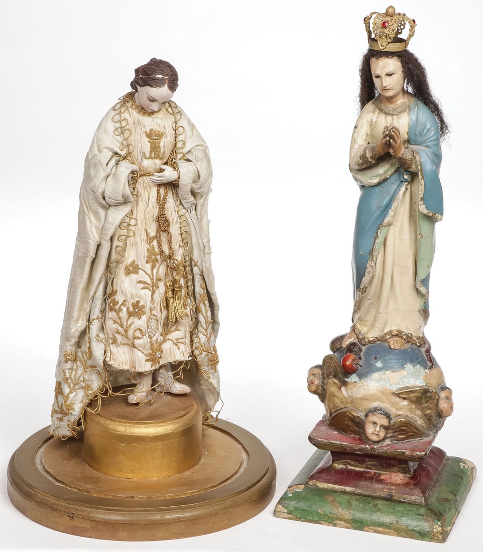A PAIR OF CARVED FIGURES OF THE VIRGIN: A PAIR OF CARVED FIGURES OF THE VIRGIN. Comprising a Neapolitan carved and polychrome figure of the Virgin, the head set with glass eyes and with original bullion embroidered silk robe, resting on a l