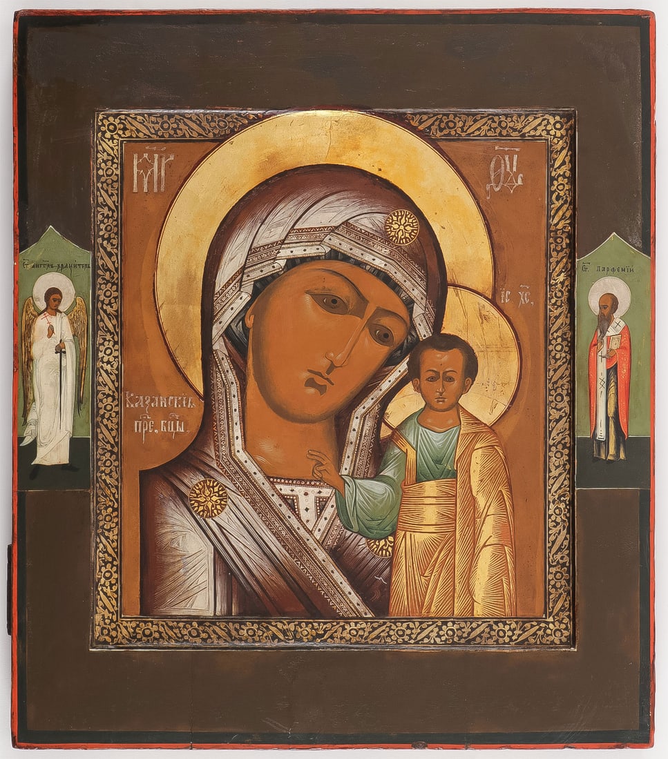 RUSSIAN ICON KAZANSKAYA, MSTERA, C. 1890.: RUSSIAN ICON KAZANSKAYA, MSTERA, C. 1890. Comprising a finely painted icon, the kovcheg decorated in silver scroll work, the borders with the Guardian Angel and with Saint Parphenin. 14 inches x 12.5 