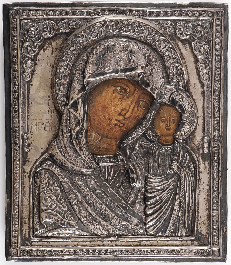 RUSSIAN ICON KAZAN MOTHER OF GOD, 18th C: RUSSIAN ICON KAZAN MOTHER OF GOD, 18th C. Of traditional composition, early 18th century and overlaid with a later silvered heavily repoussed and chased oklad, apparently unmarked. 12.5 inches x 10.5 