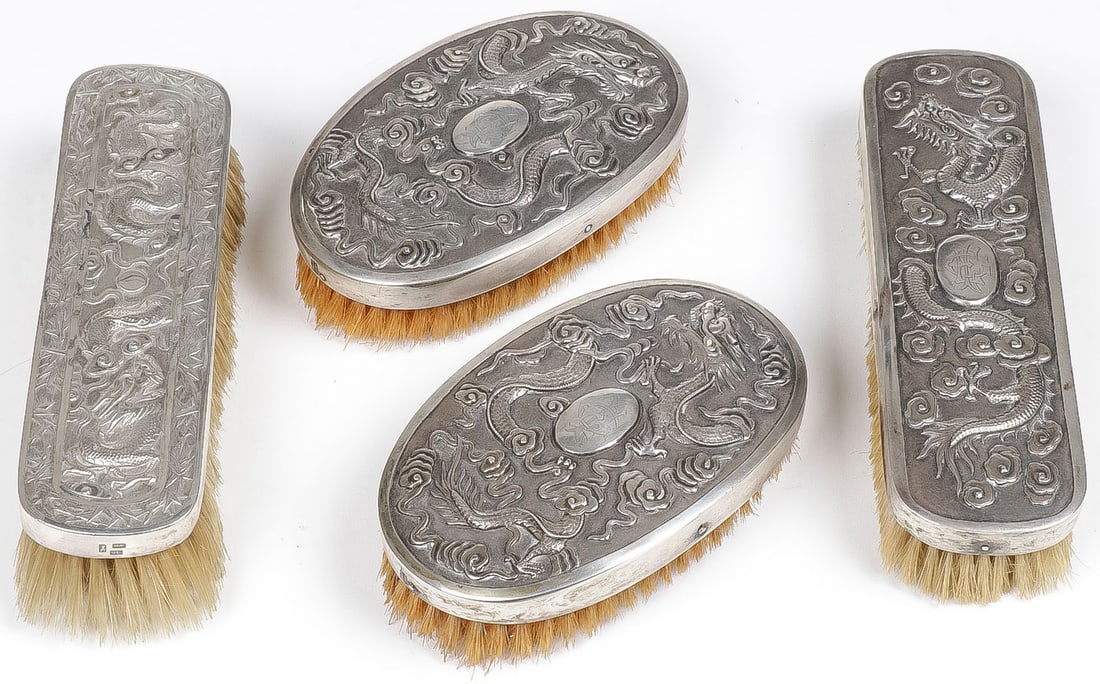 CHINESE EXPORT SILVER BRUSHES: CHINESE EXPORT SILVER BRUSHES. Each with dragon motifs including a pair of matching oval brushes and each stamped with Chinese maker mark including Wang Hing. Greatest length 7.5 inches. NO RESERVE. P