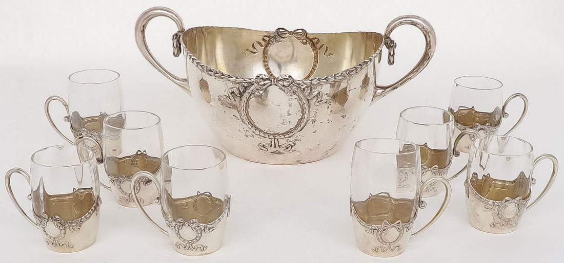 AUSTRO-HUNGARIAN SILVER PUNCH BOWL & CUPS: AUSTRO-HUNGARIAN SILVER PUNCH BOWL & CUPS. Comprising a large and impressive double handled silver punch bowl with garlands, swags and wreath, with 8 matching silver cups holders and glass inserts. Ea