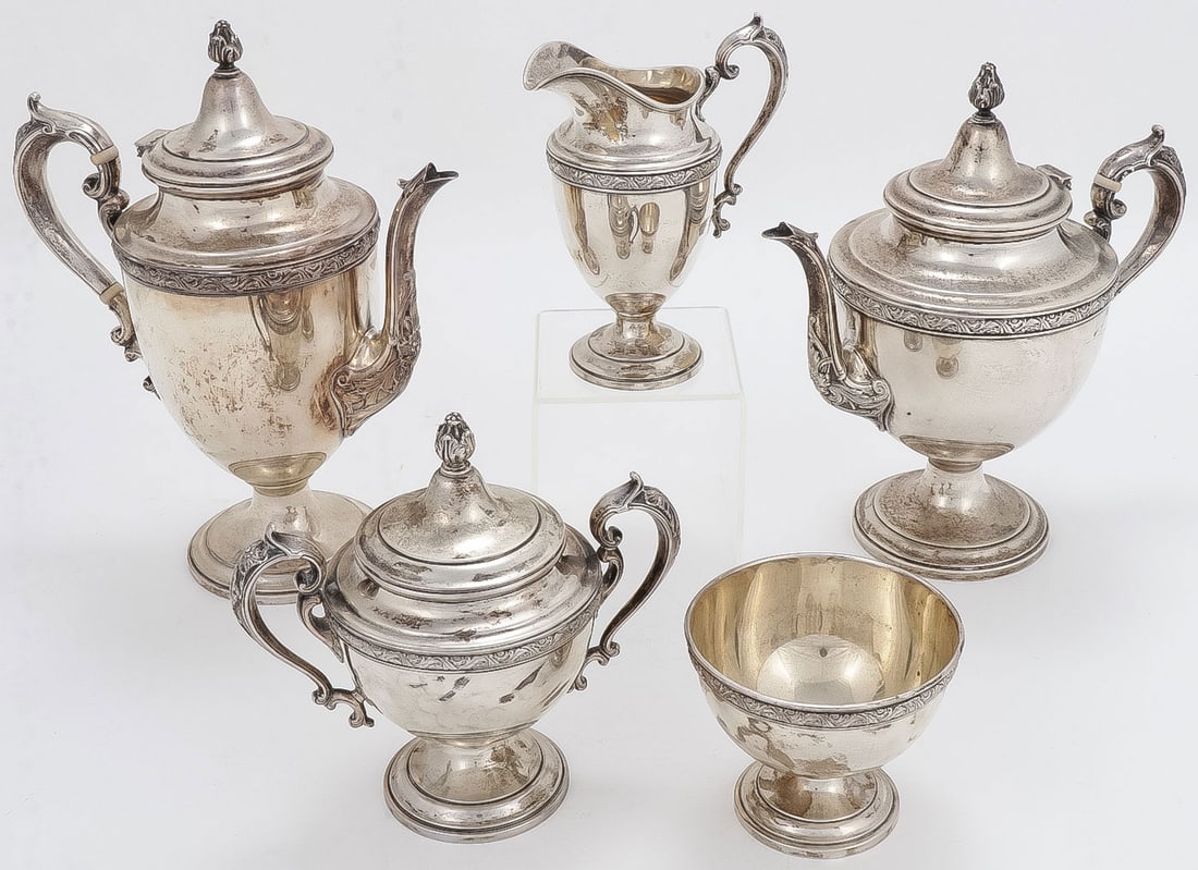AN ALVIN 5-PC STERLING TEA SERVICE: AN ALVIN 5-PC STERLING TEA SERVICE. Comprising a tea pot, coffee pot, creamer, covered sugar and waste-bowl. Each piece marked Alvin and Sterling. Greatest height, 11 inches (28cm). Total lot weight 2