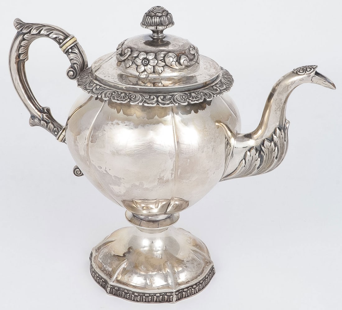 ROBERT & WILLIAM WILSON COIN SILVER TEAPOT: ROBERT & WILLIAM WILSON COIN SILVER TEAPOT. Comprising a heavy and ornate coin silver teapot, stamped R. & W. Wilson and P for Philadelphia. Height 10.25 inches. Total weight 1,240 grams. NO RESERVE.P