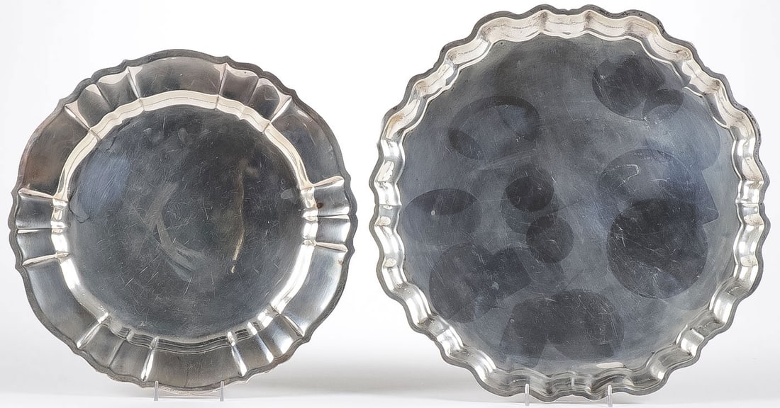 2 LARGE STERLING SILVER TRAYS: 2 LARGE STERLING SILVER TRAYS. Comprising a Gorham sterling silver 'Chippendale' tray, and an Ellmore sterling silver 'Chippendale' tray. Greatest diameter, 16 inches. Total weight 2,220 grams. NO RES