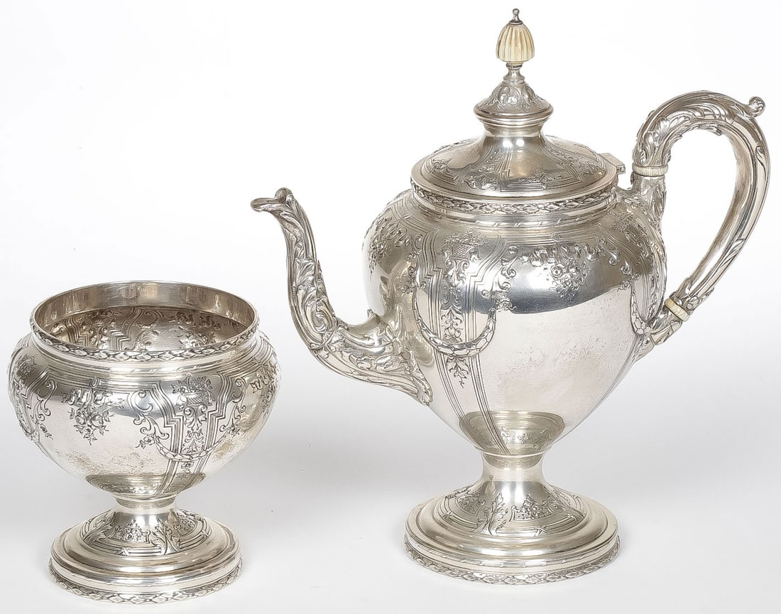 HEAVY STERLING SILVER TEAPOT AND BOWL: HEAVY STERLING SILVER TEAPOT AND BOWL. Comprising an ornate matching Dominick & Haff teapot and waste bowl, heavily repoussed and chased. Greatest height 10.3 inches.? Total weight, 1300 grams. NO RES