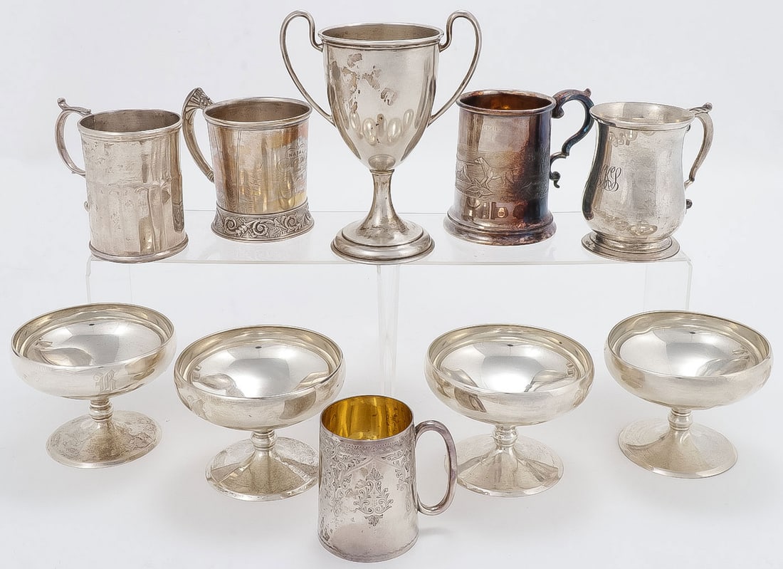 INTERESTING SILVER GROUP: INTERESTING SILVER GROUP. Comprising 10 individual pieces including a Wallace Sterling trophy cup, 4 sterling footed sherbets, an early heavy coin silver mug with scroll handle (top left), an English 