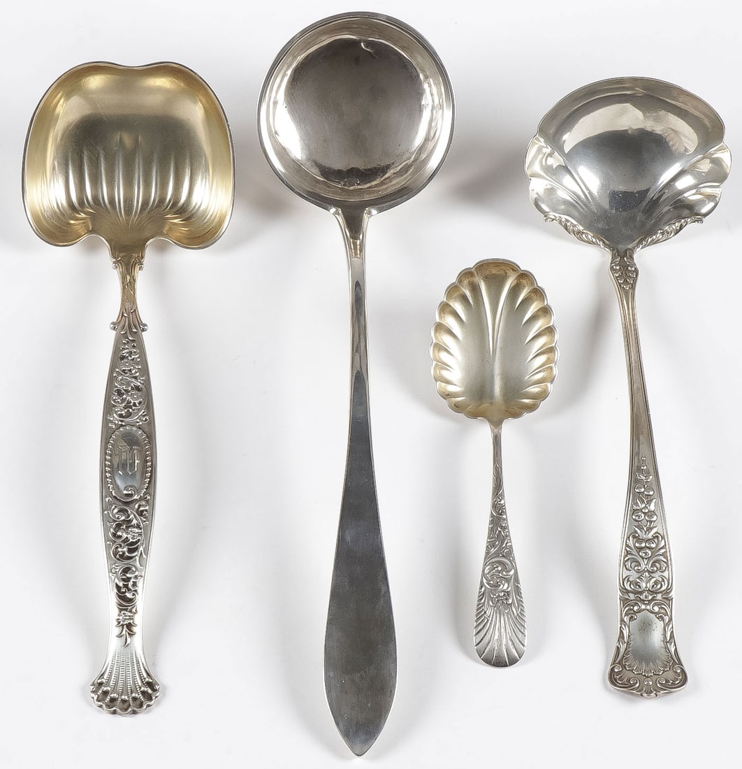 STERLING LADLES & SERVING SPOON: STERLING LADLES & SERVING SPOON. Comprising a large heavy and ornate sterling ladle, N. G. Wood & Son, a simple coin silver ladle with indistinguishable mark, perhaps GT & MS, an ornate sterling servi