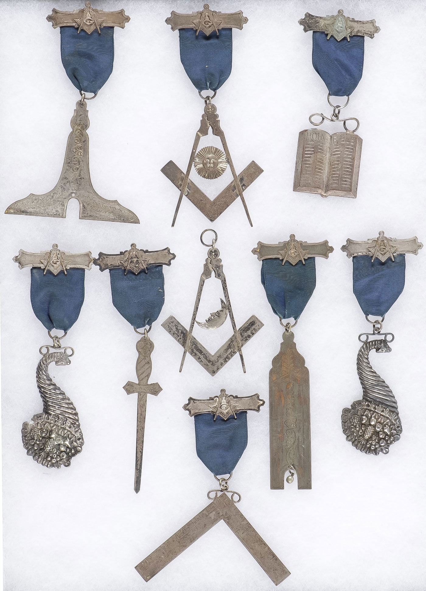 EXTENSIVE MASONIC BADGE GROUPING: EXTENSIVE MASONIC BADGE GROUPING. Comprising over 34 individual masonic ribboned badges, planchets and suspended cord enameled medallions, a good and unique offering. NO RESERVE. Provenance: From the
