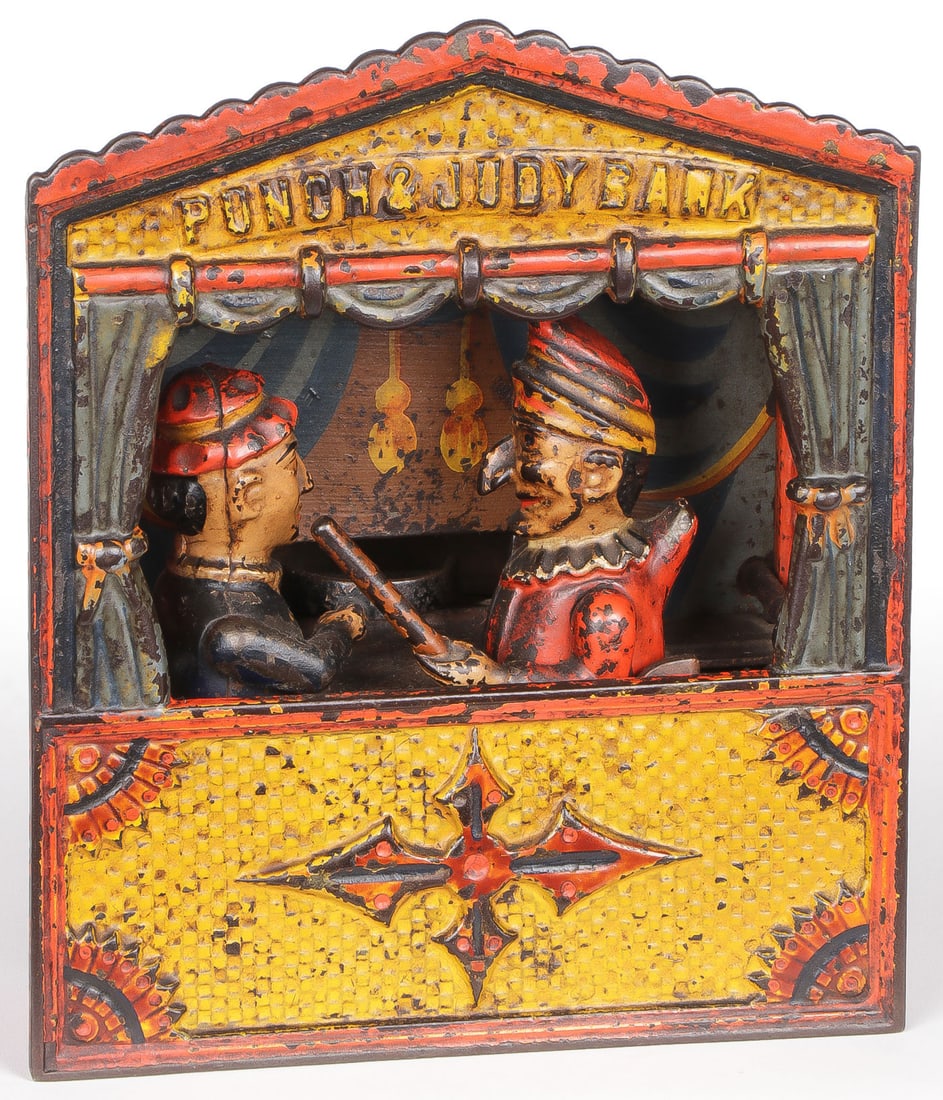 VINTAGE PUNCH & JUDY MECHANICAL BANK: VINTAGE PUNCH & JUDY MECHANICAL BANK. The medium sized letters of three versions, Shepard Hardware Co, in original paint and functions, pierced trap base with crack. NO RESERVE. SHIPPING NOTICE: Excep