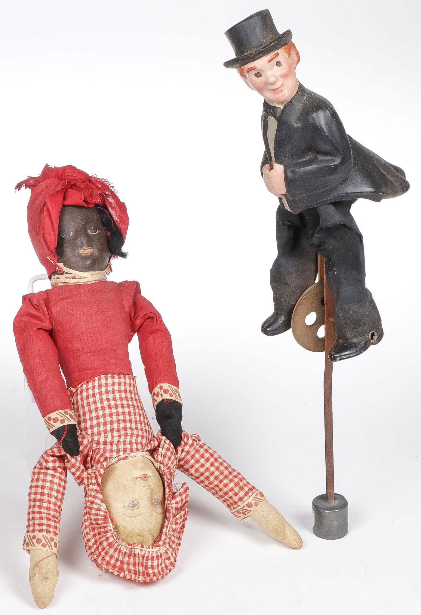 VINTAGE STRING TOY & TOPSY-TURVY DOLL: VINTAGE STRING TOY & TOPSY-TURVY DOLL. Comprising a Bruckner c. 1901 Topsy-Turvey doll, length 12.25 inches. Together with a paper mache man in top hat and tails string toy, height 15.5 inches. NO RES