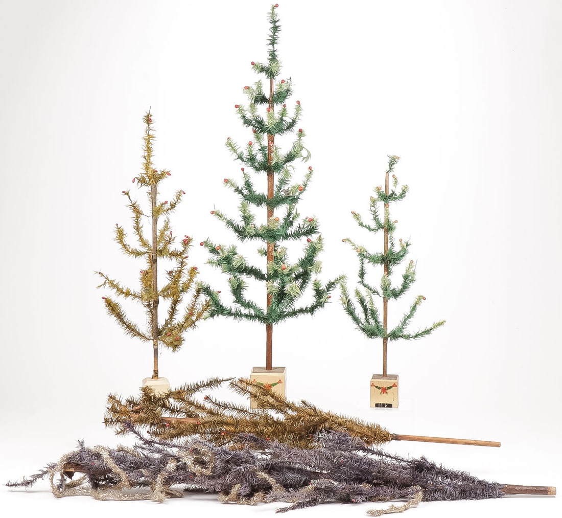 5 VINTAGE GERMAN FEATHER CHRISTMAS TREES: 5 VINTAGE GERMAN FEATHER CHRISTMAS TREES. Comprising three vintage examples in wood block stands with stenciled decoration and marked on bottom. As well as two examples without stands. Greatest height