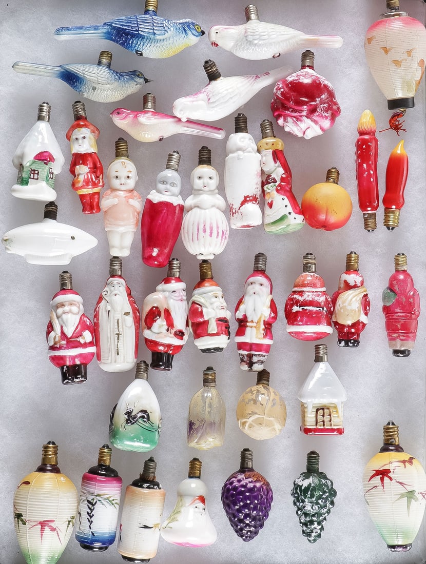 37 VINTAGE FIGURAL CHRISTMAS TREE BULBS: 37 VINTAGE FIGURAL CHRISTMAS TREE BULBS. Comprising a good assortment including 8 Santas,5 birds, 5 Chinese lanterns, children, a zeppelin, fruit and others as shown, greatest length 4 inches. Togethe