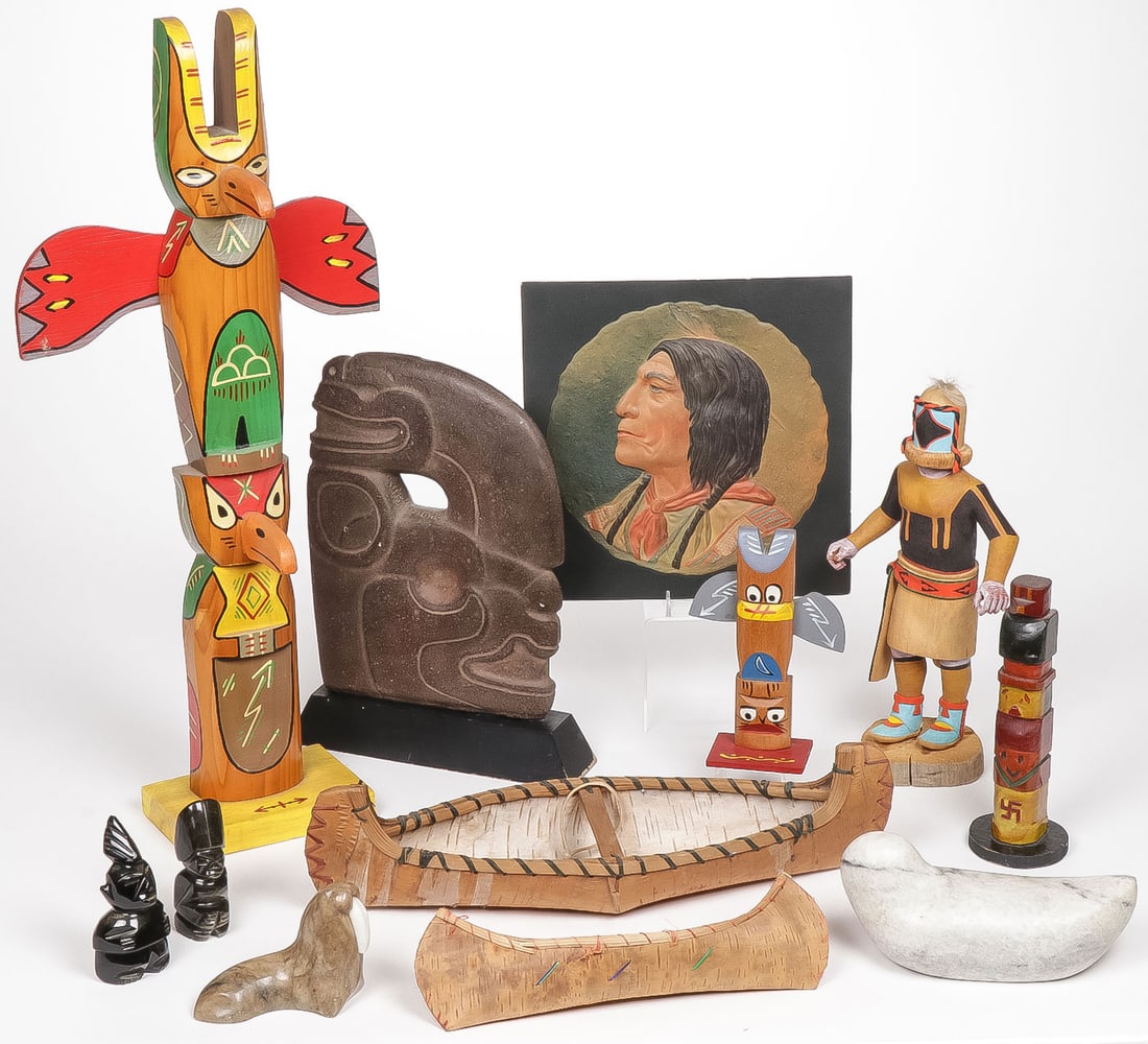 INTERESTING MIXED NATIVE AMERICAN: INTERESTING MIXED NATIVE AMERICAN. Comprising 12 individual pieces including 3 painted totems, a kachina, signed on underside of base, two birch bark canoes, Inuit stone carvings a color relief printe