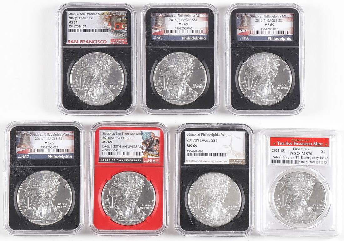 SEVEN $1 SILVER EAGLES (1 of 2)