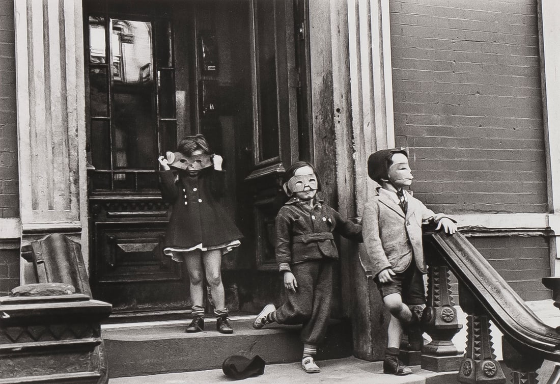 HELEN LEVITT PHOTOGRAPH: HELEN LEVITT (American 1913-2009)Masked Children on Stoop, New York -1940Gelatin silver on Kodak, a later impressionVerso with stamped copyright label HELEN LEVITT 4 EAST 12 STREET NY.Image 6.75 inc