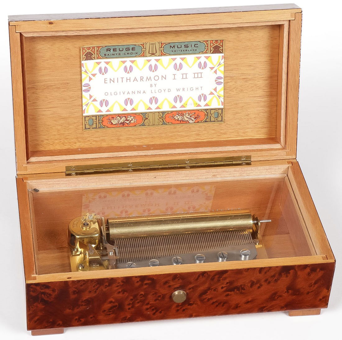 UNIQUE OLGIVANNA LLOYD WRIGHT MUSIC BOX: UNIQUE OLGIVANNA LLOYD WRIGHT MUSIC BOX. Comprising a unique exotic wood "ENITHARMON I II III Swiss music box, the interior of lid with Olgivanna Lloyd Wright label marked Taliesin and underside also