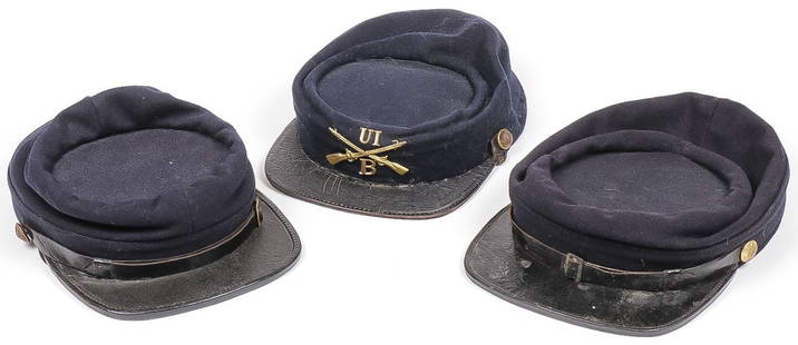 3 CIVIL WAR /INDIAN WAR KEPIS: 3 CIVIL WAR /INDIAN WAR KEPIS. Each of fine dark blue wool two with tarred leather reinforced crowns, cotton lining, original leather sweatbands, standard federal eagle buttons, leather chin strap wit