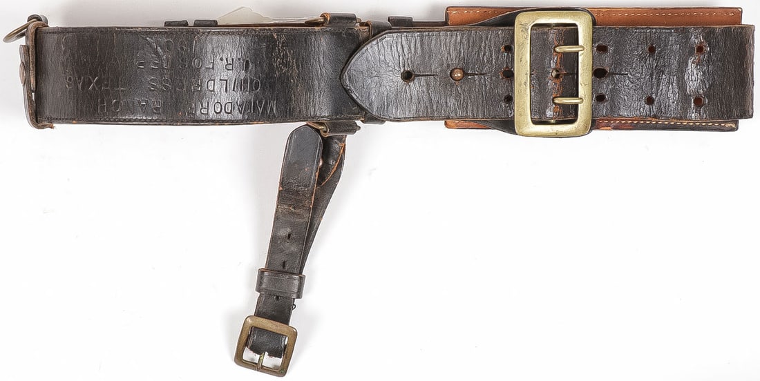 COWBOY PISTOL BELT, MATADOR RANCH, 1901: COWBOY PISTOL BELT, MATADOR RANCH, CHILDRESS TEXAS, 1901. Comprising a fine leather pistol belt, with large brass rectangular buckle, leather hanger with brass buckles, and 12 round cartridge holder a