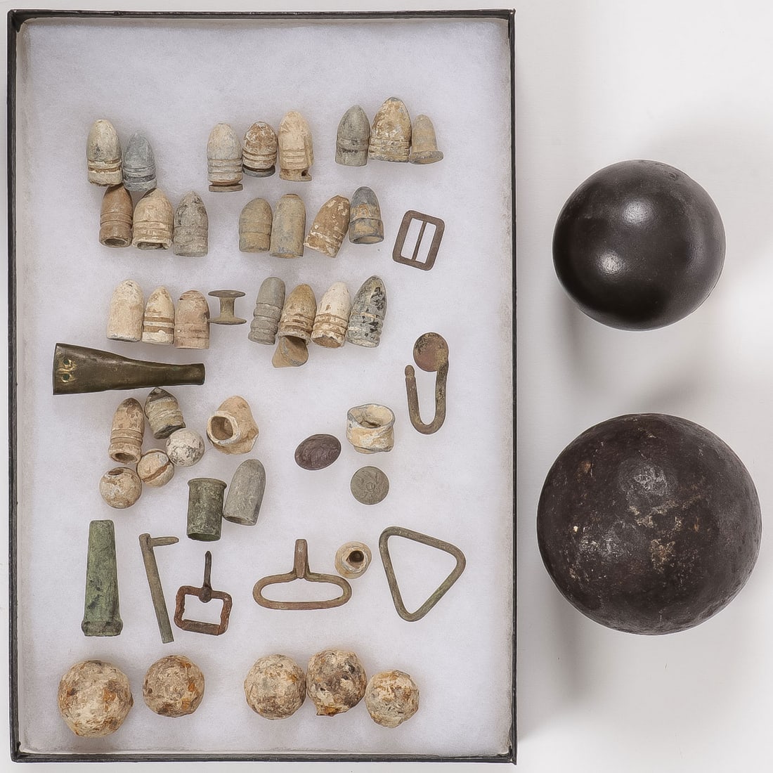 CIVIL WAR ORDINANCE AND RELIC GROUP: CIVIL WAR ORDINANCE AND RELIC GROUP. Comprising 50 individual pieces including 33 bullets and mini balls including three Gardner ?2 ring' bullets, some grape shot, 2 Union uniform buttons, hooks, 2 bu