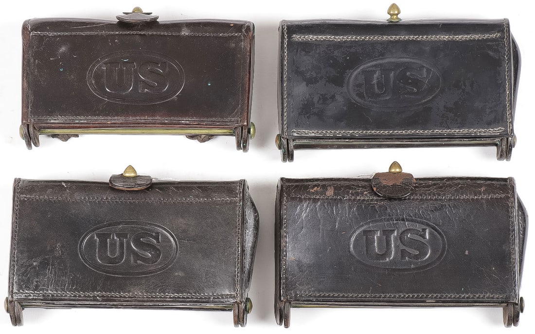 FOUR GOOD MCKEEVER CARTRIDGE POUCHES: FOUR GOOD MCKEEVER CARTRIDGE POUCHES. Comprising three type 3 examples, each with US oval on flap, each with Watervliet arsenal mark, the interior of one marked F. 3RD CAV. No. 23, each missing takedo