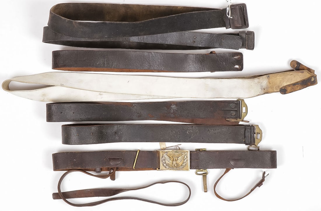 US CIVIL WAR & INDIAN WARS BELTS & SLINGS: US CIVIL WAR & INDIAN WARS BELTS & SLINGS. Comprising a good M1874 officer's belt with equipment hook and saber-strap and officer's eagle belt-plate, stamped Rock Island Arsenal and inspector's initia