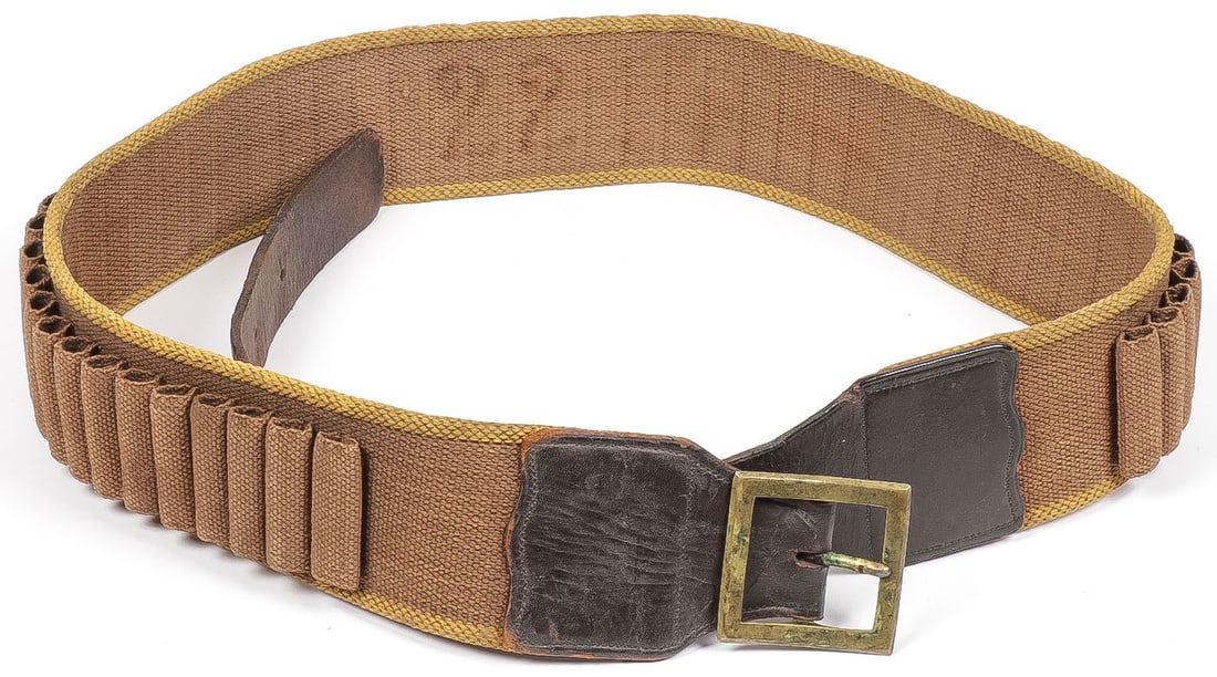 SCARCE PATTERN 1885 U.S. CAVALRY CARTRIDGE BELT: SCARCE PATTERN 1885 U.S. CAVALRY CARTRIDGE BELT. Comprising a very fine M1885 cavalry cartridge belt, the brown khaki woven belt with yellow selvage, no eyelets, leather tongue billet with square bras