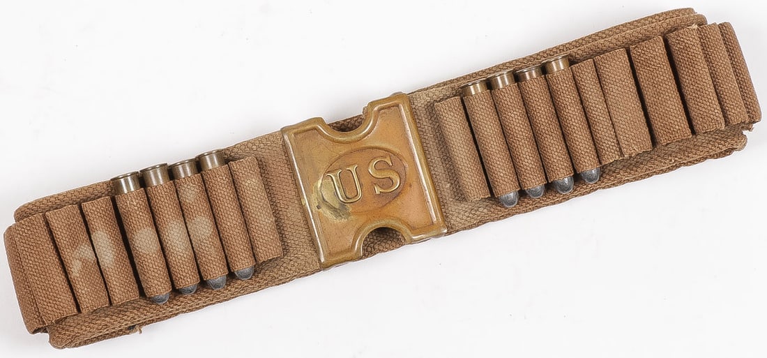 M1885 CAVALRY MILLS WEB BELT W CARTRIDGES: M1885 CAVALRY MILLS WEB BELT W CARTRIDGES & BUCKLE. Comprising a good Indian Wars pattern 1885 Mills Cavalry Cartridge Belt. Full length in its original form and with all 45 cartridge loops intact, fo