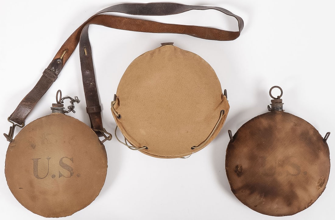THREE U.S. CANTEENS INCLUDING LANZ: THREE U.S. CANTEENS INCLUDING LANZ. Comprising a M1878 with canvas cover unit marked and with U.S. and triangular swivel rings and leather strap. A M1904 canvas covered, U.S. stencil and with square r