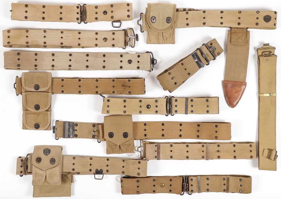 12 U.S. WWI CARTRIDGE BELTS: 12 U.S. WWI CARTRIDGE BELTS. Comprising 12 individual mostly M1912 belts with variations as shown, three with pouches for .45 cal. 1911 magazines, one with stack three pocket pouch for the .38 cal. re