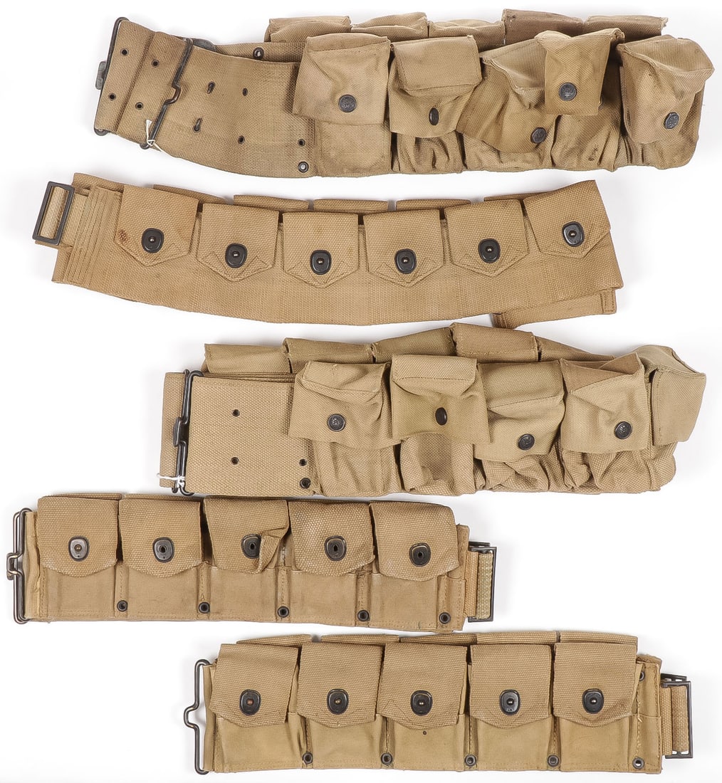 5 PRE WAR & WWI CARTRIDGE BELTS INCL RARE MILLS: 5 PRE WAR & WWI CARTRIDGE BELTS INCL RARE MILLS. Comprising two M1917 cartridge belts each with 10 pouches with "lift the dot" fasteners, both named on verso, both stamped LONG on verso one dated 17 t