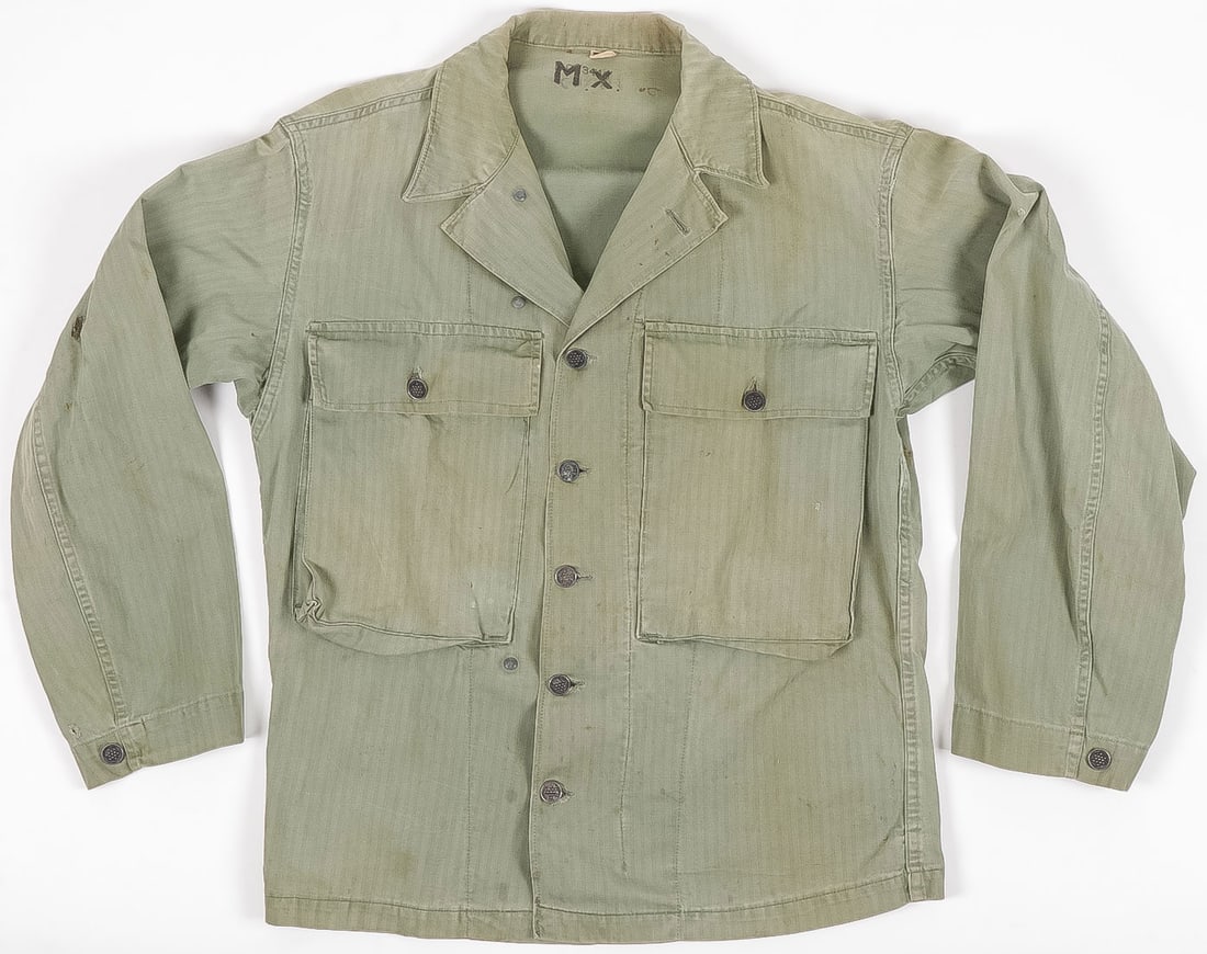US WWII ARMY HBT 13 STARS BUTTONS COMBAT SHIRT: GOOD US WWII ARMY HBT 13 STARS BUTTONS COMBAT SHIRT. Of typical design with two large pockets, gas flap and 13 star metal buttons throughout. Size 36R. Overall nice patina and some small sewn field re