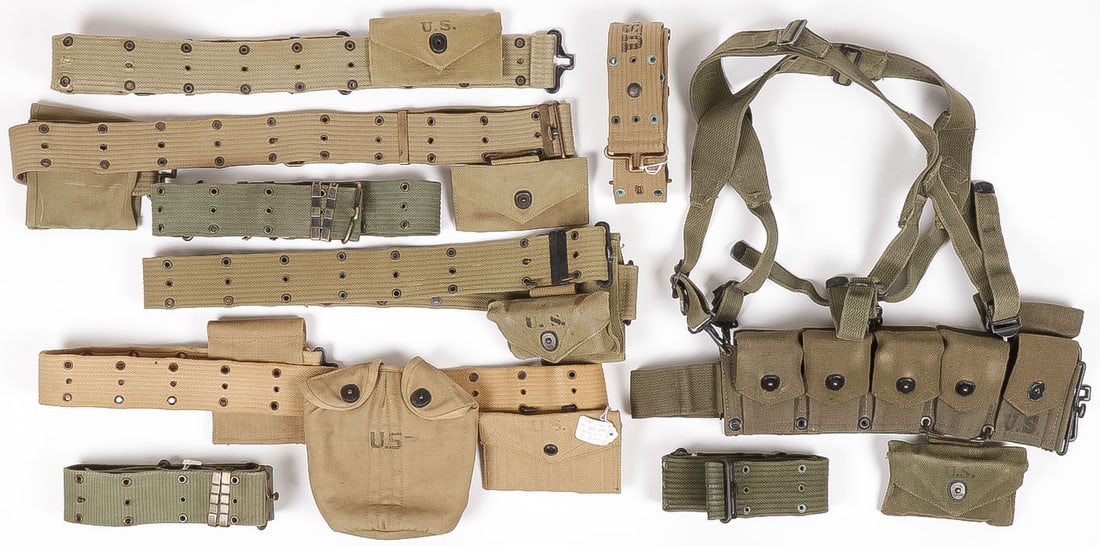 8 U.S. PISTOL BELTS & MORE WWII-KOREA: 8 U.S. PISTOL BELTS & MORE WWII-KOREA. Comprising 8 web U.S pistol belts, three with first aid pouches, three with double pouch for .45 magazines, one entirely British made and marked, with magazine p