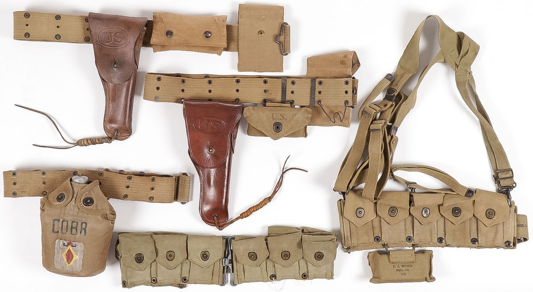 U.S. MOSTLY WWII WEB GEAR INCL USMC: U.S. MOSTLY WWII WEB GEAR INCL USMC. Comprising essentially 5 separate pieces including a U.S.M.C. cartridge belt, stamped on inside U.S.M.C., makers name Boyt and dated 43, a web belt with canteen, t