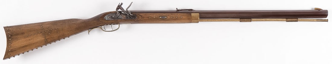 CONNECTICUT VALLEY ARMS .50 CAL FLINTLOCK RIFLE: CONNECTICUT VALLEY ARMS .50 CAL FLINTLOCK RIFLE. Maple half stock with brass studs/tacks throughout, brass hardware, engraved lock plate, double set triggers, adjustable rear sight. Side of barrel mar