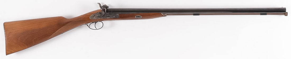 A NAVY ARMS PERCUSSION SHOTGUN: A NAVY ARMS PERCUSSION SHOTGUN. Comprising a like new and likely never fired, Navy Arms, double barrel .12 ga. percussion shotgun. Walnut stock with checkered grip, engraved lock plates and tang, top