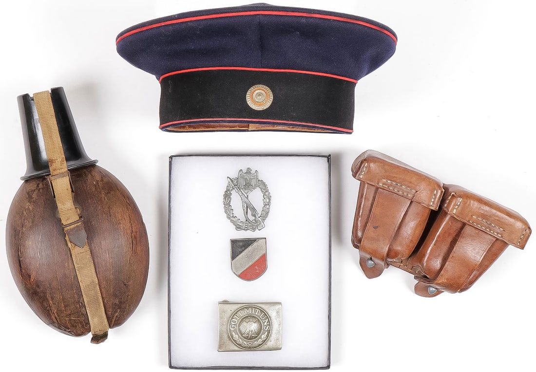 GERMAN WWI & WWI ACCOUTREMENTS: GERMAN WWI & WWI ACCOUTREMENTS. Comprising 6 individual items including an Imperial German (WWI) artillery tellermutze in good condition, original brown leather sweatband, polished cotton liner with m